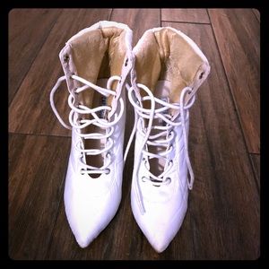 White bubble boot laced up.